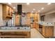 Well-appointed kitchen with custom wood cabinets and stainless steel appliances at 6530 Ridgeview Dr, Morrison, CO 80465