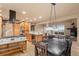 Spacious kitchen with custom wood cabinets, an island and stainless appliances at 6530 Ridgeview Dr, Morrison, CO 80465