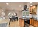 Bright kitchen with stainless steel appliances, granite counters, eat-in dining area, and views of the surrounding winter landscape at 6530 Ridgeview Dr, Morrison, CO 80465