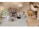 Open living room with fireplace, vaulted ceilings and access to adjoining rooms at 6530 Ridgeview Dr, Morrison, CO 80465