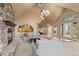 Inviting living room features stone fireplace, vaulted ceilings, and natural light at 6530 Ridgeview Dr, Morrison, CO 80465