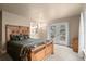 Cozy main bedroom with wood accents, outdoor access, and an en-suite bathroom, offering a peaceful and private retreat at 6530 Ridgeview Dr, Morrison, CO 80465
