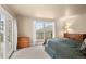 Bright bedroom featuring mountain views and outdoor access, creating a serene and inviting space to unwind and enjoy the natural surroundings at 6530 Ridgeview Dr, Morrison, CO 80465
