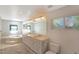 Modern bathroom with a soaking tub, dual sinks, and ample counter space at 6684 E Bates Ave, Denver, CO 80224