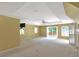 Expansive bedroom featuring plush carpeting, a sliding door, and ample natural light at 6684 E Bates Ave, Denver, CO 80224