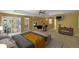 Comfortable main bedroom with a ceiling fan, and access to a screened-in porch at 6684 E Bates Ave, Denver, CO 80224