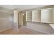 Bright walk-in closet with built-in shelving, providing ample storage space with mirrors at 6684 E Bates Ave, Denver, CO 80224