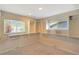 A walk-in closet space with built-in shelves and windows for ample storage and organization at 6684 E Bates Ave, Denver, CO 80224