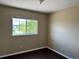 Vacant bedroom offers laminate wood flooring, neutral walls, and a window providing natural light and neighborhood views at 20787 E 39Th Ave, Denver, CO 80249