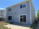 Side of the house with a sliding glass door leading to a patio at 20787 E 39Th Ave, Denver, CO 80249