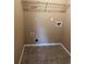 This empty laundry room features tile flooring, neutral walls, and hookups for a washer and dryer at 20787 E 39Th Ave, Denver, CO 80249
