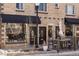 Charming brick building with inviting storefronts and outdoor seating, in the popular retail district at 1947 Jay St, Lakewood, CO 80214