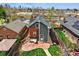 An aerial view shows a charming home with a concrete patio and lush lawn in a vibrant neighborhood at 2716 N Columbine St, Denver, CO 80205