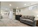 Basement living area features a wet bar and comfortable seating at 2716 N Columbine St, Denver, CO 80205