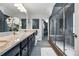 Luxurious bathroom with glass shower, granite double vanity, and access to walk-in closet at 2716 N Columbine St, Denver, CO 80205