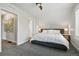 Cozy bedroom with soft carpet, recessed lighting, and two access doors creating a serene retreat at 2716 N Columbine St, Denver, CO 80205