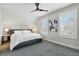 Bright bedroom with soft gray carpet, two windows, and neutral decor for a peaceful atmosphere at 2716 N Columbine St, Denver, CO 80205