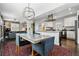 Beautiful dining room with modern lighting fixture, view into the kitchen and living room at 2716 N Columbine St, Denver, CO 80205