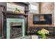 Beautiful fireplace with a vintage mantel, exposed brick, and decorative elements at 2716 N Columbine St, Denver, CO 80205