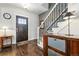 Inviting foyer with hardwood floors, stylish staircase, and decorative accents at 2716 N Columbine St, Denver, CO 80205