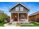 Charming brick home with a welcoming front porch and well-maintained landscaping at 2716 N Columbine St, Denver, CO 80205