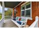 Relax on the front porch swing of this charming brick home at 2716 N Columbine St, Denver, CO 80205