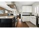 Modern kitchen featuring granite countertops, stainless steel appliances and dark wood flooring at 2716 N Columbine St, Denver, CO 80205