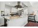 Gourmet kitchen features granite counters, stainless appliances, and large island at 2716 N Columbine St, Denver, CO 80205