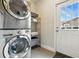 Convenient laundry area with a stacked washer/dryer unit and easy access to the outdoors at 2716 N Columbine St, Denver, CO 80205