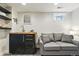 Cozy basement living area features a comfortable couch and wet bar at 2716 N Columbine St, Denver, CO 80205