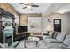 Comfortable living room featuring a fireplace, large windows, and stylish decor at 2716 N Columbine St, Denver, CO 80205