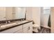 Bathroom featuring a double sink with granite countertop, a toilet, and a mirror at 4327 Wilson Peak Dr, Castle Rock, CO 80104
