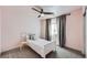 Bedroom with a white bed frame, carpeted floor, and a window featuring gray curtains at 4327 Wilson Peak Dr, Castle Rock, CO 80104
