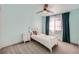 Cozy bedroom with soft, light-blue walls, a ceiling fan, and lots of natural light at 4327 Wilson Peak Dr, Castle Rock, CO 80104
