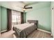 Bedroom featuring a ceiling fan, carpeted floor and a gray upholstered bed frame at 4327 Wilson Peak Dr, Castle Rock, CO 80104