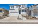 Charming two-story home with a well-manicured front yard and attached garage at 4327 Wilson Peak Dr, Castle Rock, CO 80104