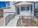 Inviting front porch with decorative wreath and concrete steps leading to the entrance at 4327 Wilson Peak Dr, Castle Rock, CO 80104
