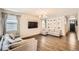 Spacious living room with hardwood floors, neutral paint, large sectional, and flat screen TV at 4327 Wilson Peak Dr, Castle Rock, CO 80104