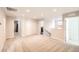 Spacious carpeted loft area with multiple doorways, closet, and a staircase at 4327 Wilson Peak Dr, Castle Rock, CO 80104
