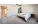 Spacious main bedroom featuring a ceiling fan, soft carpet, and an ensuite bathroom at 4327 Wilson Peak Dr, Castle Rock, CO 80104