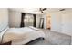 Bright main bedroom featuring neutral walls, carpeted floor, large windows and an ensuite bathroom at 4327 Wilson Peak Dr, Castle Rock, CO 80104