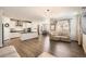 Open floorplan living room that flows into the kitchen and dining areas at 4327 Wilson Peak Dr, Castle Rock, CO 80104
