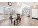 Bright dining area with hardwood floors and a charming table setting at 1265 Button Rock Dr, Longmont, CO 80504