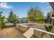 Expansive backyard with gravel, a fire pit, and a charming bench seating area for outdoor relaxation at 19661 E Girard Ave, Aurora, CO 80013