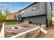 Cozy backyard with a gravel area, fire pit, bench, and a concrete retaining wall with wood at 19661 E Girard Ave, Aurora, CO 80013