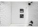 Close-up of a modern bathroom with white subway tile and black fixtures at 19661 E Girard Ave, Aurora, CO 80013