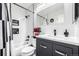 Stylish bathroom with subway tile, black fixtures, and a modern vanity at 19661 E Girard Ave, Aurora, CO 80013