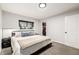 Comfortable bedroom featuring carpet, large window, and a closet at 19661 E Girard Ave, Aurora, CO 80013