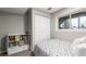 Cozy bedroom features a closet, shelves, and natural light at 19661 E Girard Ave, Aurora, CO 80013