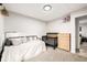 Cozy bedroom with day bed, crib, and natural wood dresser at 19661 E Girard Ave, Aurora, CO 80013